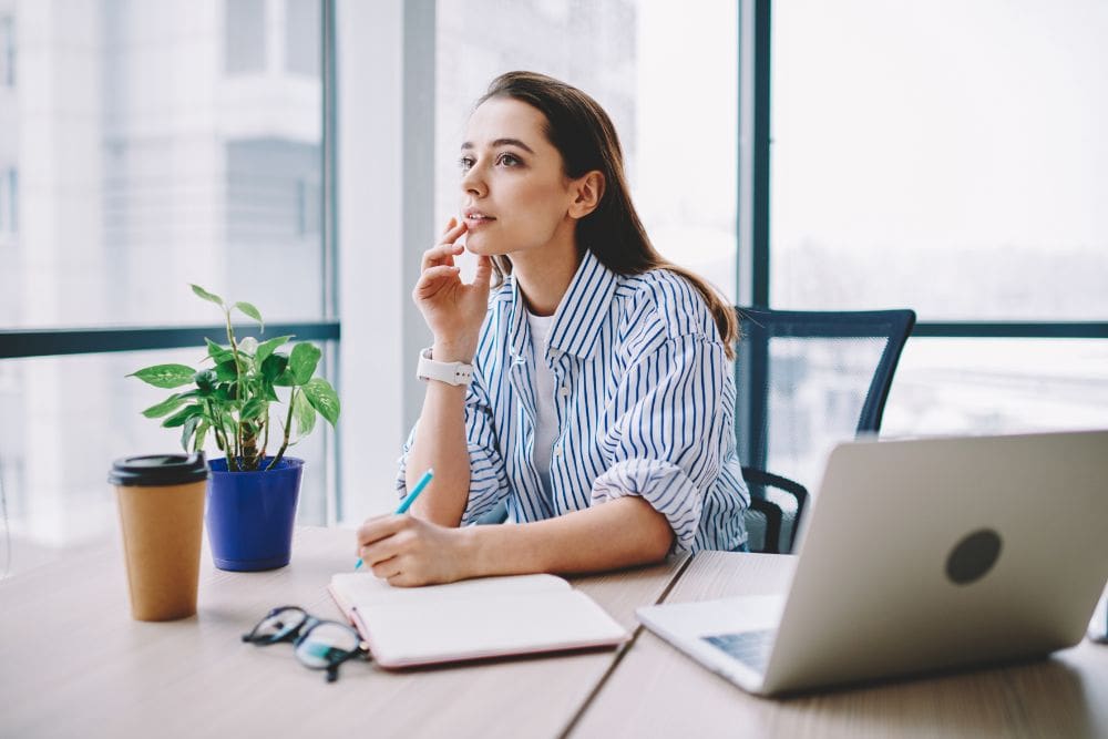 Lady carrying out a content audit on his landing page