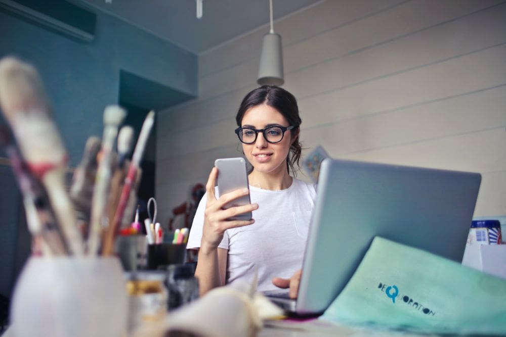 A person working on a laptop, setting up an online business