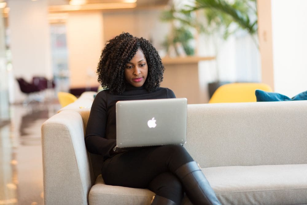 Lady on laptop doing some freelance work from her home rating, user, survey.